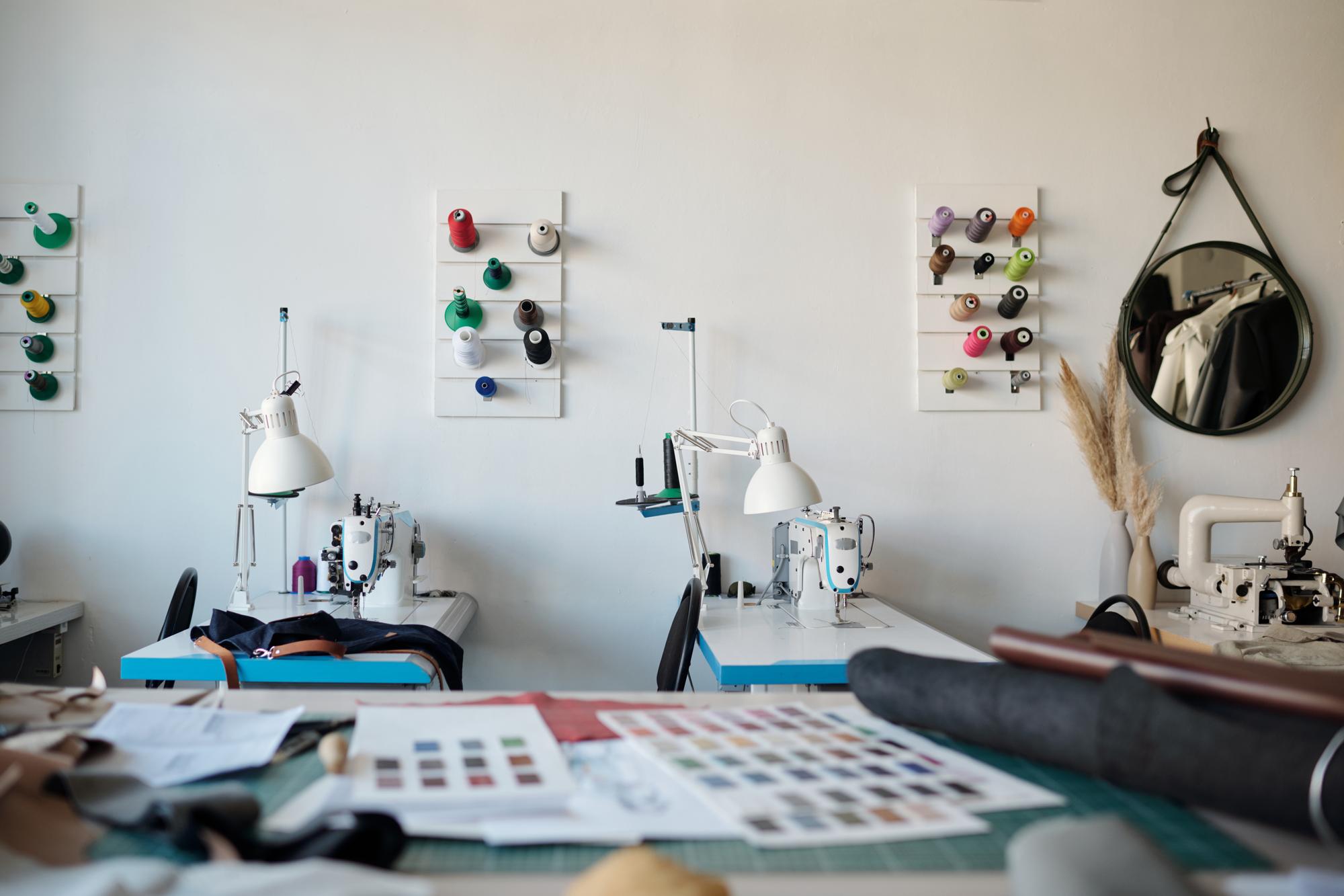 Workshop workstation with embroidery machine and threads